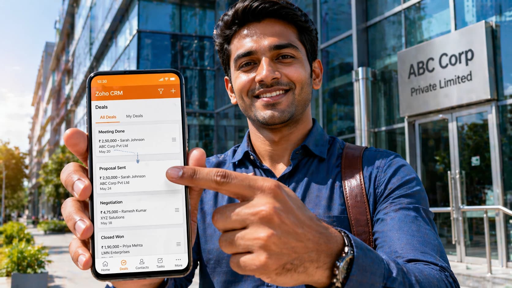 Field sales rep updating Zoho CRM deal status on mobile after customer visit